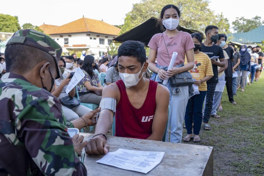 Teenagers wait their turn with others during a mass Covid-19 vaccination drive in Denpasar, Bali, Indonesia, on July 2. In a study of over 1,000 higher education students in China, Indonesia, Malaysia, and Thailand, 38 per cent indicated they had experienced “mild-to-moderate” depression and anxiety.