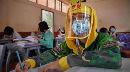 Primary school students at Thai Raj Kiri school in Mae Sot district, Tak province return to school in July last year after school closures due to the COVID-19 pandemic.