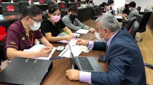 Dr Alireza Khadem, one of the three WHO evaluators, (right)  discuss with officials from the Thai FDA during the assessment mission, on 1 June 2021 